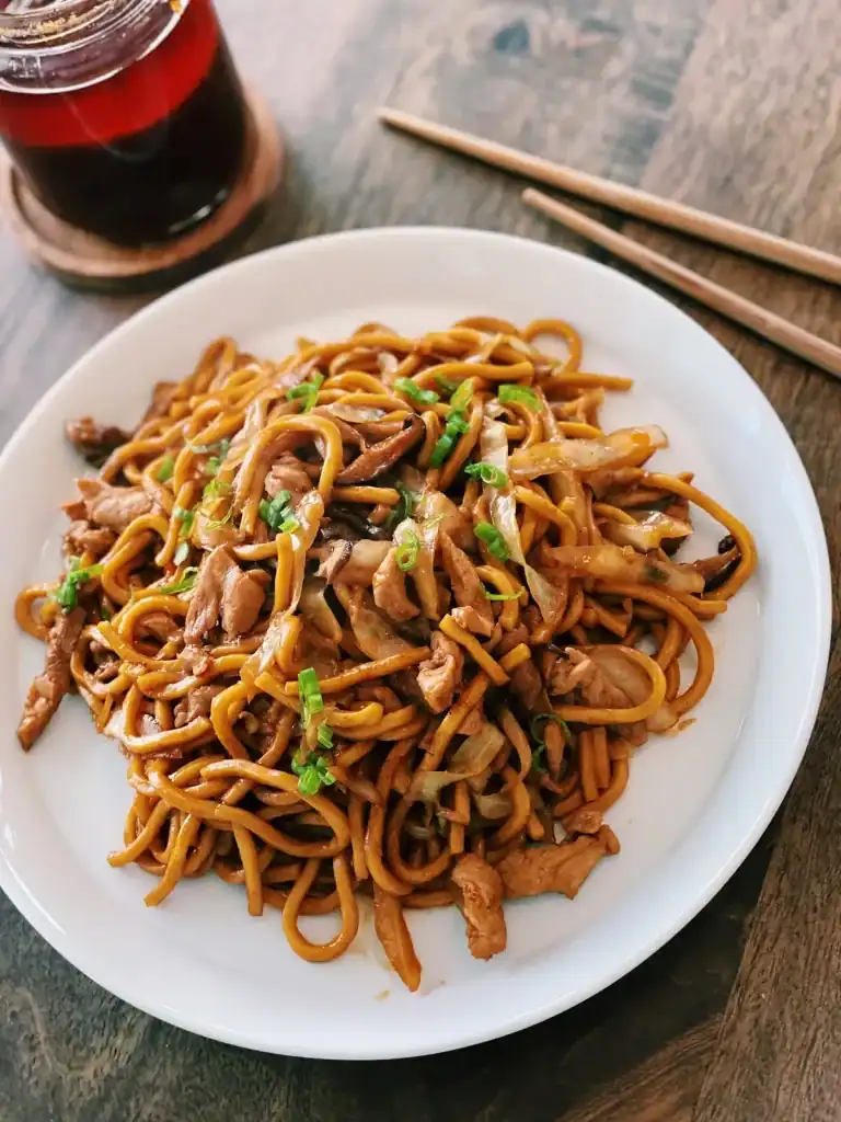 Pork Shanghai Noodles Served in a Plate with Chili Oil on the side