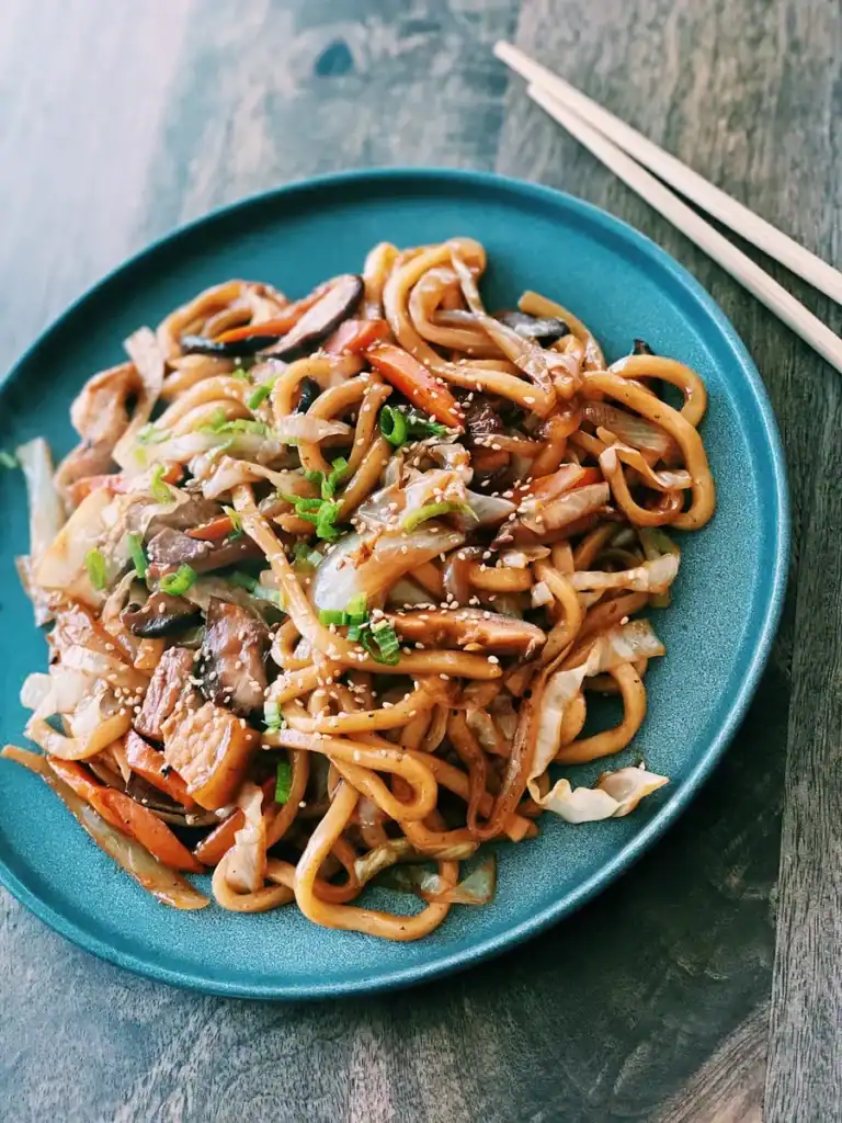 A plate of pork belly yakiudon