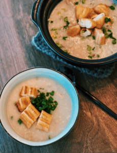 Speedy Cantonese Chicken Congee that saves so much time, served in a small bowl with Chinese doughnuts