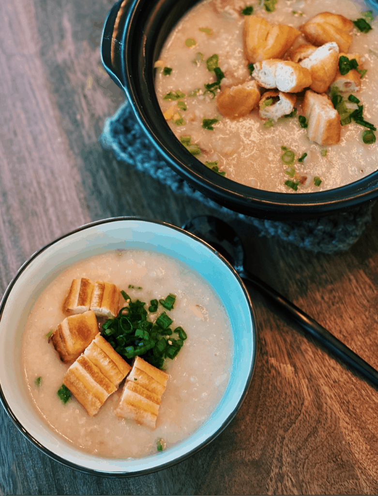 Speedy Cantonese Chicken Congee that saves so much time, served in a small bowl with Chinese doughnuts