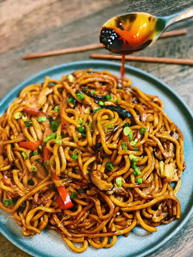 Adding Chili Oil To Vegetarian Shanghai Noodles