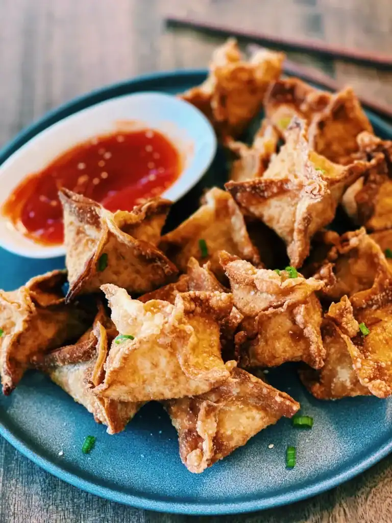 Fried Crab Rangoons served with sweet sour sauce