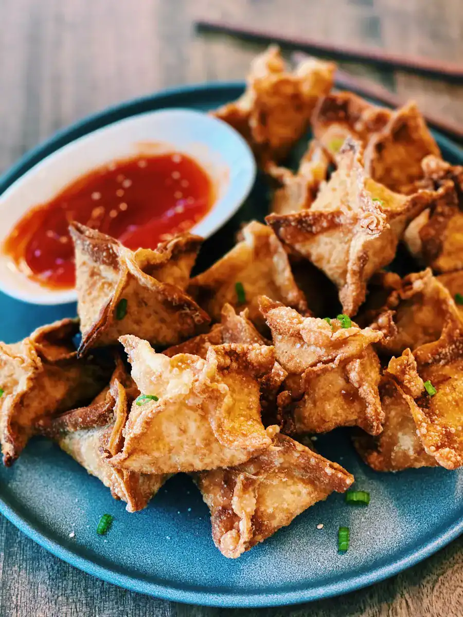 Fried Crab Rangoons served with sweet sour sauce