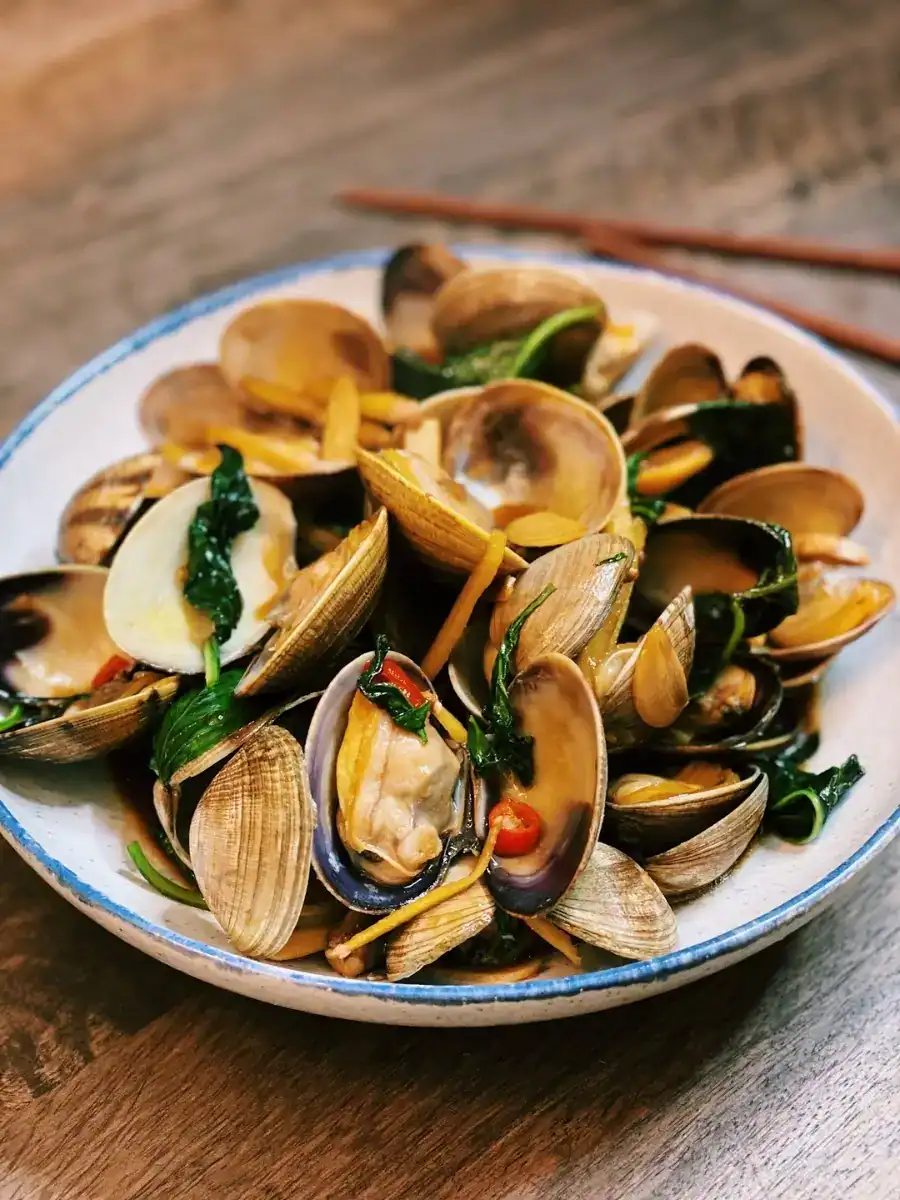 A plate of Beer House Authentic taiwanese Style basil clams 