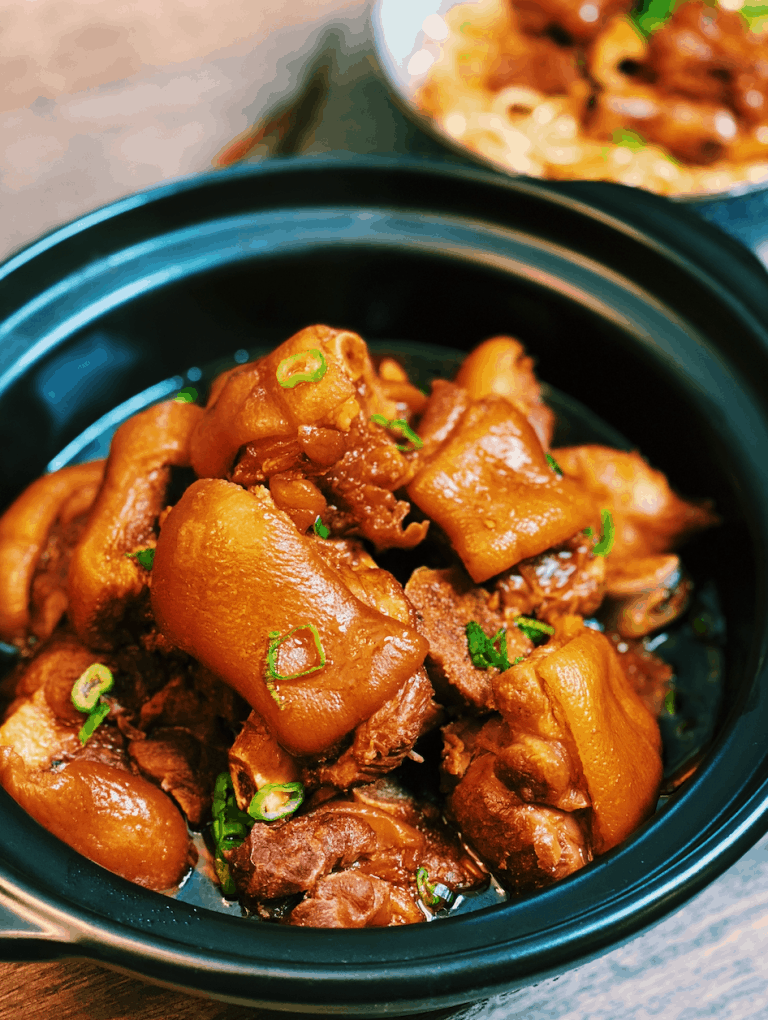 Taiwanese Braised Pork Hock served in a clay pot with rice on the side