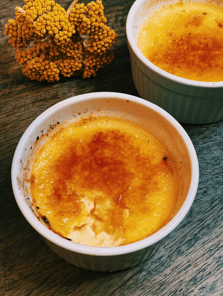 A photo of a creamy and rich Instant Pot Creme Brulee, topped with a perfectly caramelized sugar crust, representing a delicious Asian holiday dessert.