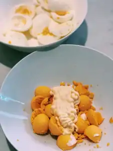 Separating egg white and yolk and mixing Japanese Mayo and egg yolk for egg salad filling for Japanese Egg Sandwich