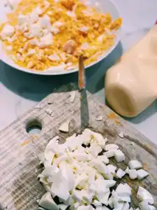 Chopping up egg white to mix with egg yolk and mayo as a egg salad filling for Tamago Sando, or Japanese Egg Sandwich