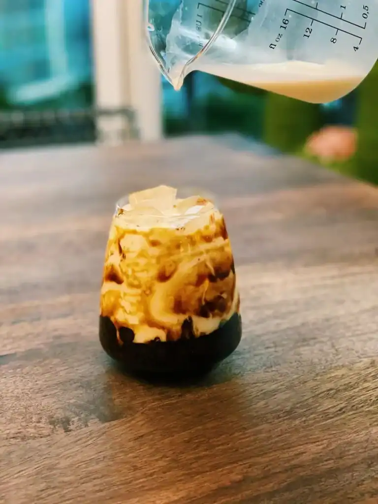 Pouring Milk into Cup for Brown Sugar Boba Milk Tea