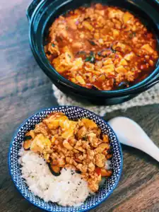 Spicy Mapo Tofu is typically served with rice in family style dinners