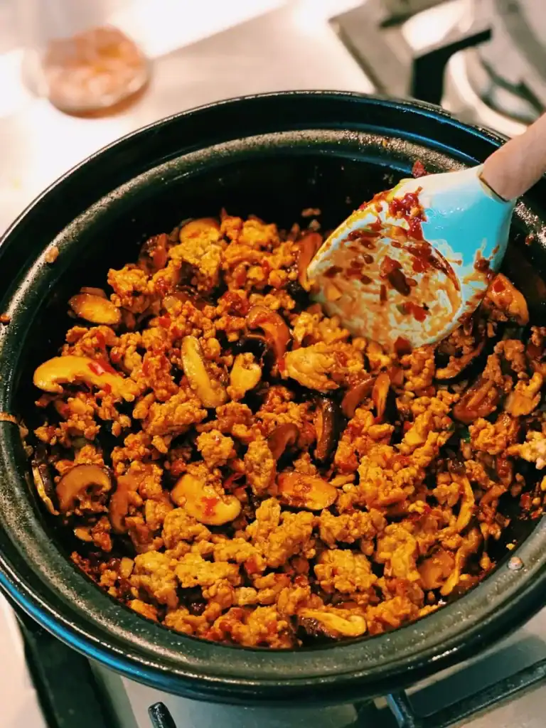 Sauteeing Ground pork and mushrooms for Mapo Tofu