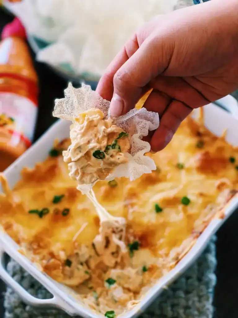 Dipping Sriracha Mayo Chicken Dip with wonton chips