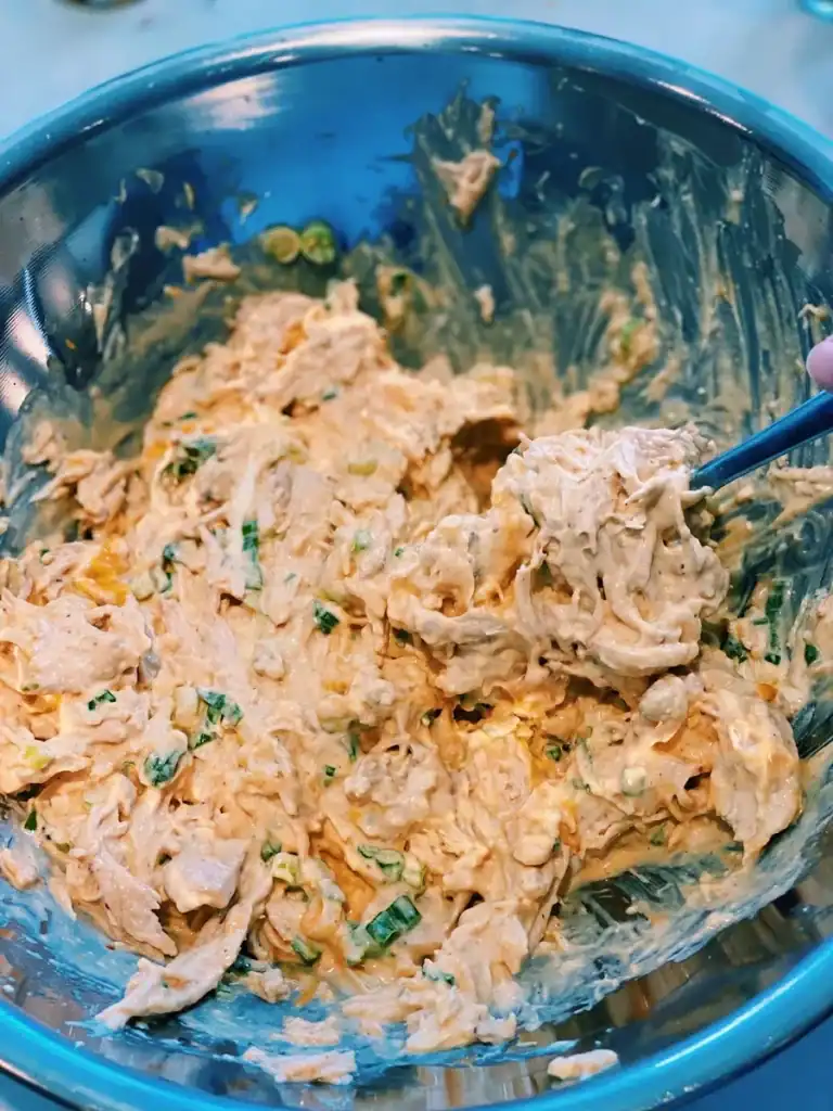 Mixing Sriracha Mayo Shredded Chicken Dip
