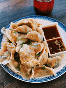 Vegetarian Dumplings, beautifully presented with a crunchy cabbage and mushroom filling, exemplifying delicious Asian vegetarian cuisine.