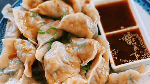 Vegetarian Dumplings, beautifully presented with a crunchy cabbage and mushroom filling, exemplifying delicious Asian vegetarian cuisine.