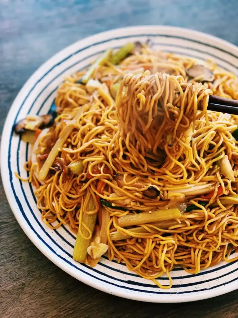 Vegetarian Chow Mein picked up with a pair of chopsticks