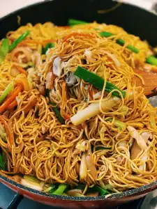 Cooking Vegetarian Chow Mein in a pan