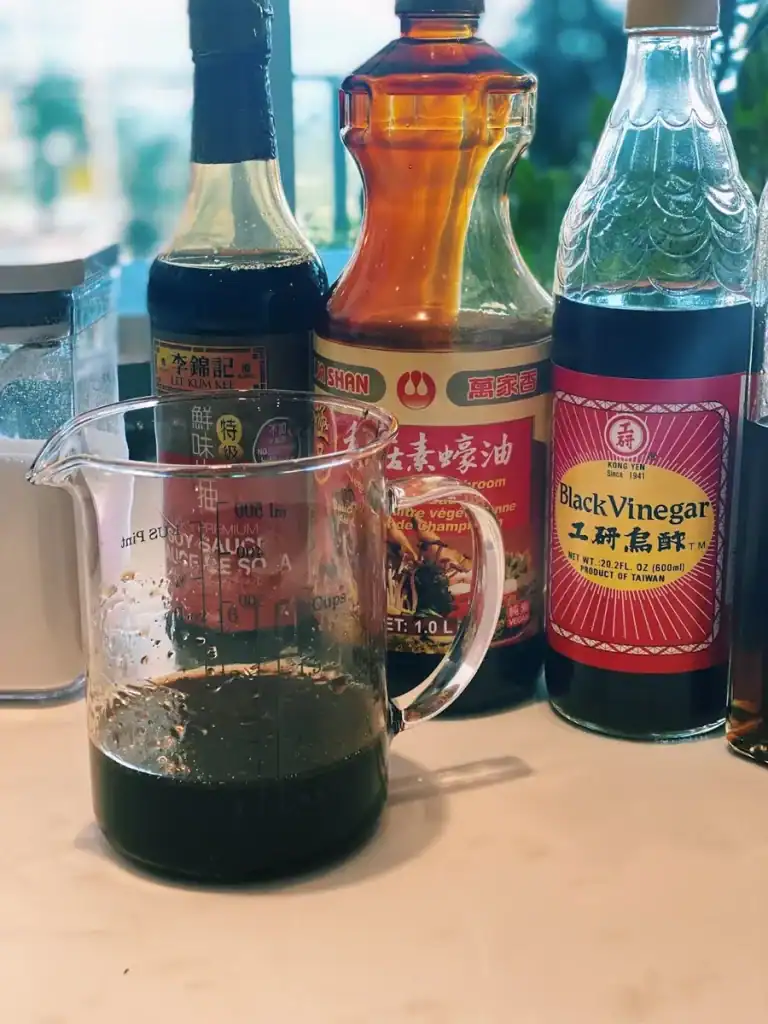 A mix of sauces for Vegetarian Chow Mein, including black vinegar, soy sauce, oyster sauce, black pepper, sesame oil,
and sugar