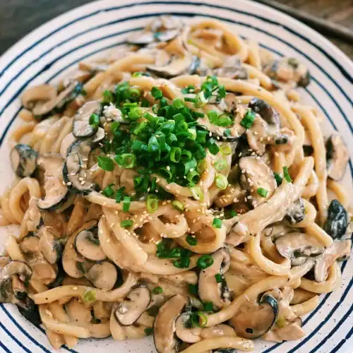 Creamy Mushroom Udon Plated with green onion