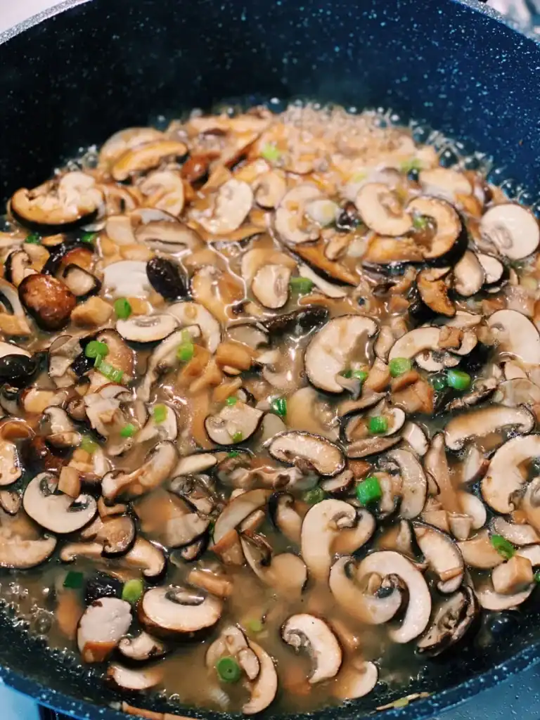 Sautéing mushrooms for creamy mushroom udon