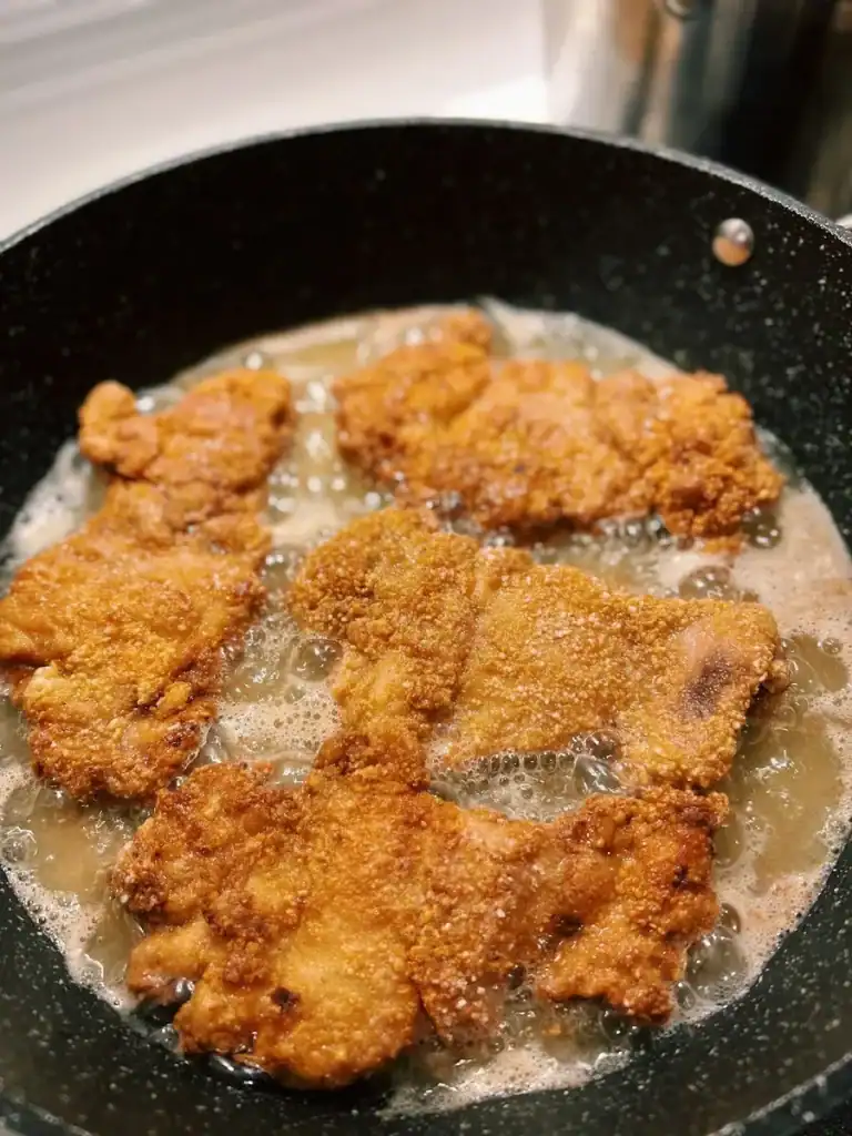 Shallow frying Taiwanese Bento Chicken Cutlet in a Non-stick pan