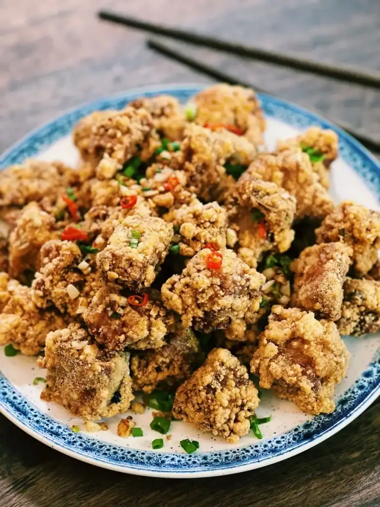 A plate full of salt and pepper spare ribs freshly fried