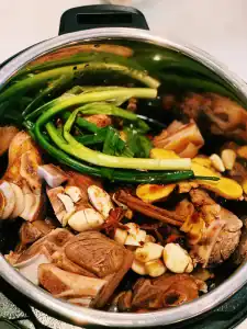 Aromatics added into the instant pot with Braised Pork Hock