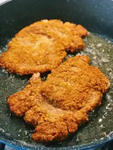Shallow Frying Taiwanese Pork Chops in a pan