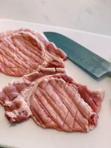 Cutting pork chops for Taiwanese Bento Fried Pork Chops