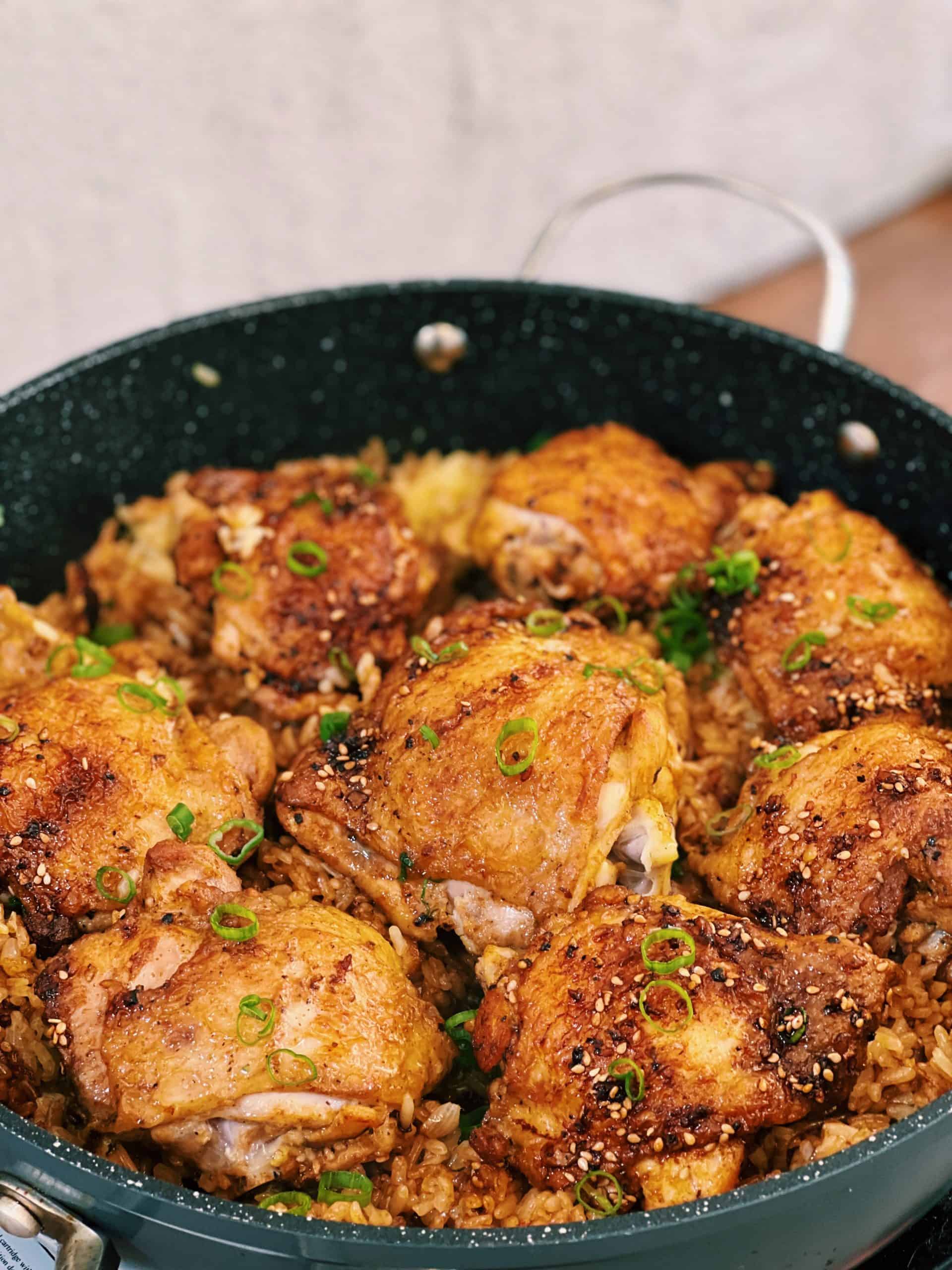 One Pot Chicken and Rice with black pepper sauce served in a pan