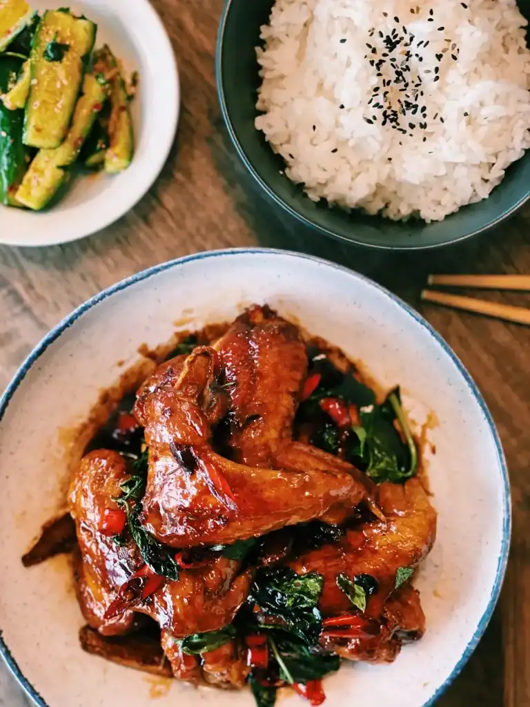 3 cup chicken wing served with rice and cucumbers
