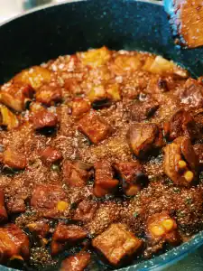 Simmering pork spare ribs in sweet and sour sauce for Taiwanese Sweet and Sour Pork Spare Ribs