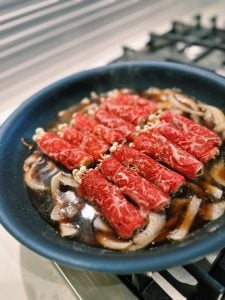 Enoki Beef Rolls added to Gyudon Sauce for Enoki Beef Rice Bowl