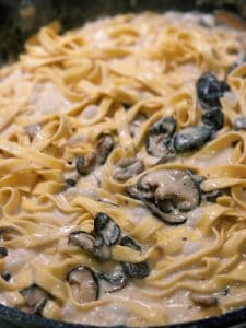 Adding pasta into creamy miso mushroom sauce for Creamy Miso Mushroom Pasta
