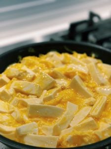 fluffy egg and tofu setting shape in pan