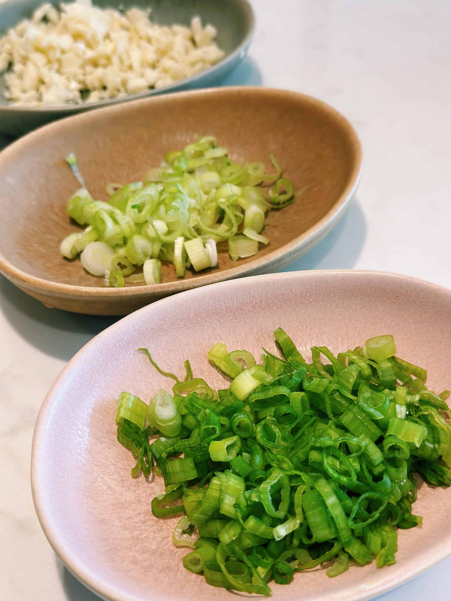 chopped and separated green onions for Sizzling Spicy Garlic Tofu
