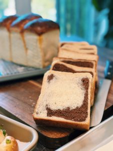 Super easy loaf of freshly baked Chocolate Milk Bread, a fluffy chocolate swirl asian bread made with tangzhong