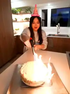 Torching Mayo Crab Spicy Salmon Sushi Cake for a caramelized mayo on top