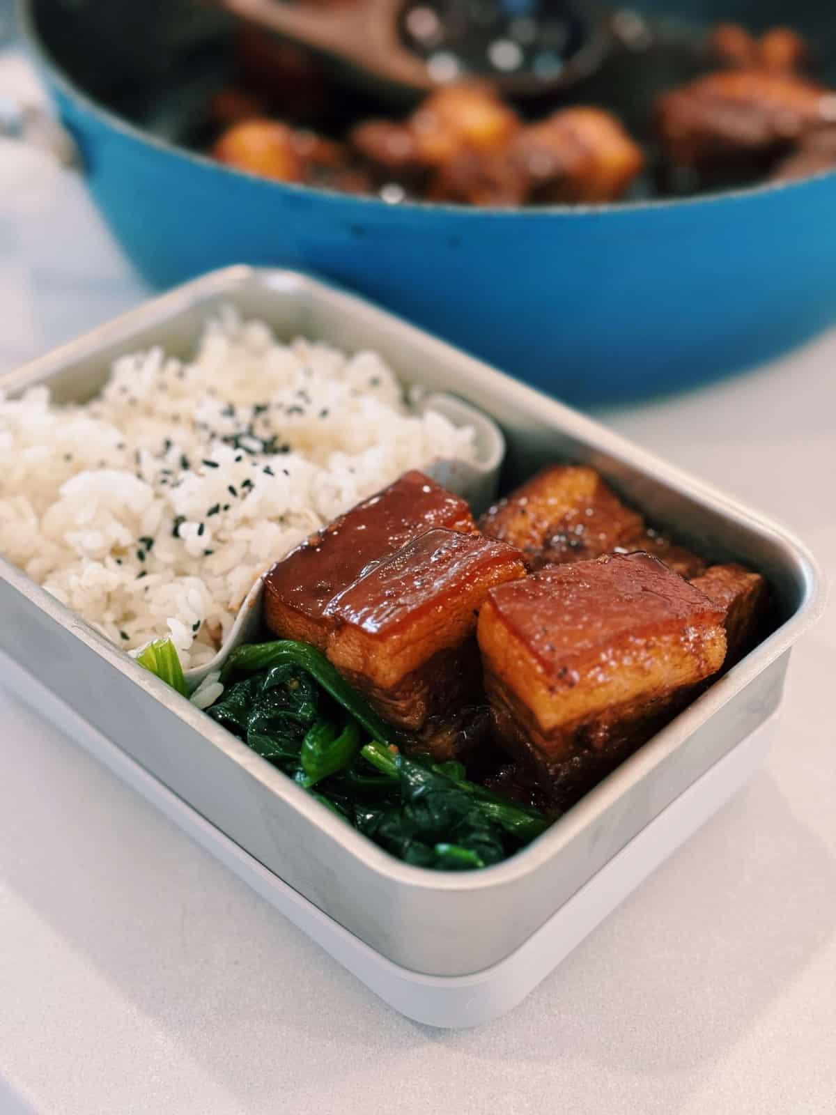 hearty lunchboxes packed with glistening taiwanese braised pork, korean blanched spinach salad, a heaping helping of white rice topped with sesame seeds