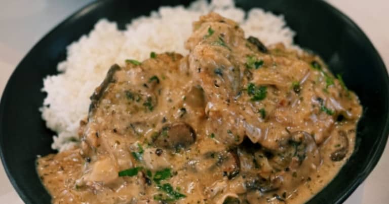 Creamy Mushroom and Chicken garnished with green onion, served with rice