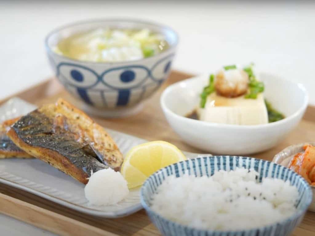 Traditional Japanese Breakfast made of rice, tofu, air fried mackerel, and miso soup