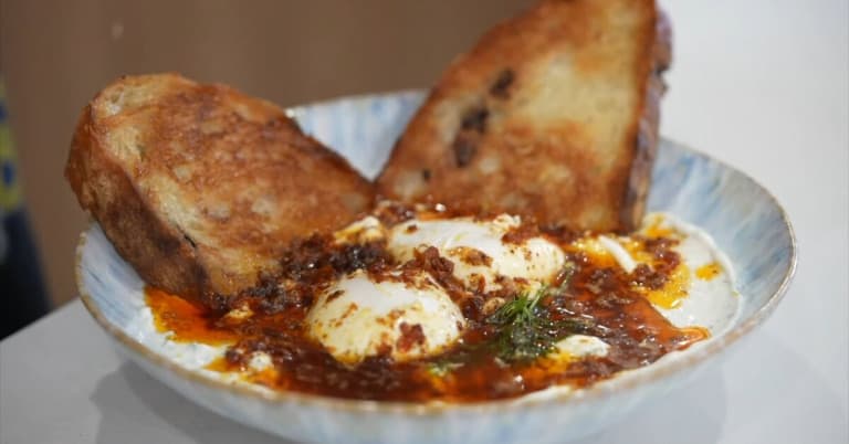 Turkish Eggs with Chili Oil Served with Toasted Olive Bread