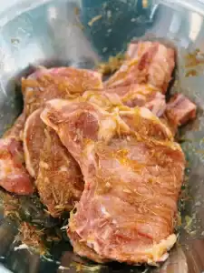Marinating Bone-in Porkchops in garlic, lemongrass, fish sauce, oyster sauce, sugar, chili flakes for Air Fryer Lemongrass Pork Chops