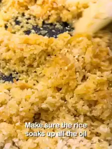 Next, add the rice and mix well. Make sure the rice soaks up all the chicken juices and oil for the one pot chicken and rice