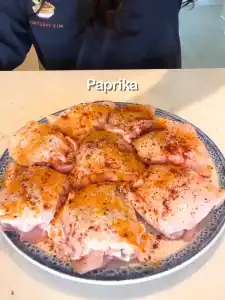 Season the chicken with paprika, cumin, salt, black pepper, turmeric, and garlic powder (optional). Rub the chicken to make sure it is coated well with seasoning.