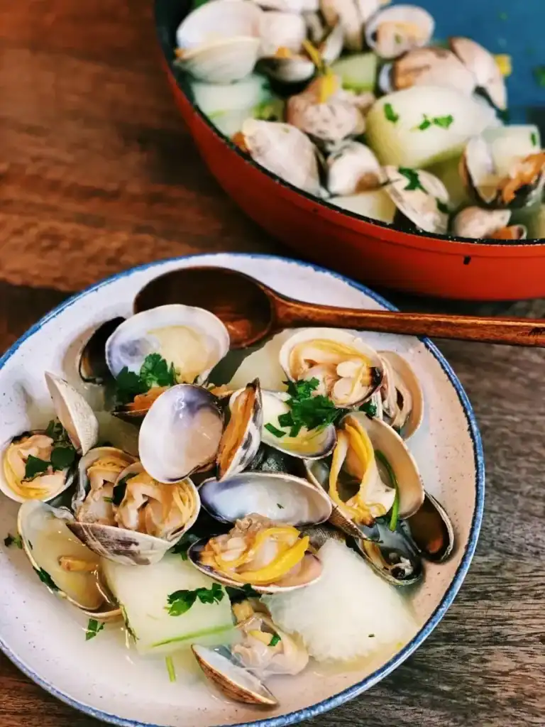 Steamed Clam and Wintermelon Soup served into a separate bowl