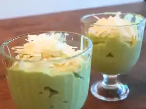 Vietnamese Avocado Smoothie topped with condensed milk and shredded coconut