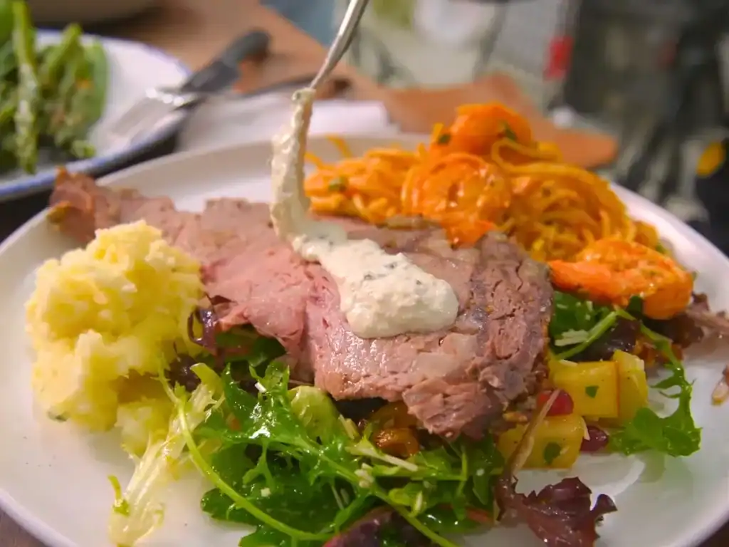 A plate showing parts of Tiffy's 6 course prime rib meal for her family, with prime rib, mashed potatoes, whaldorf salad, and shrimp pasta