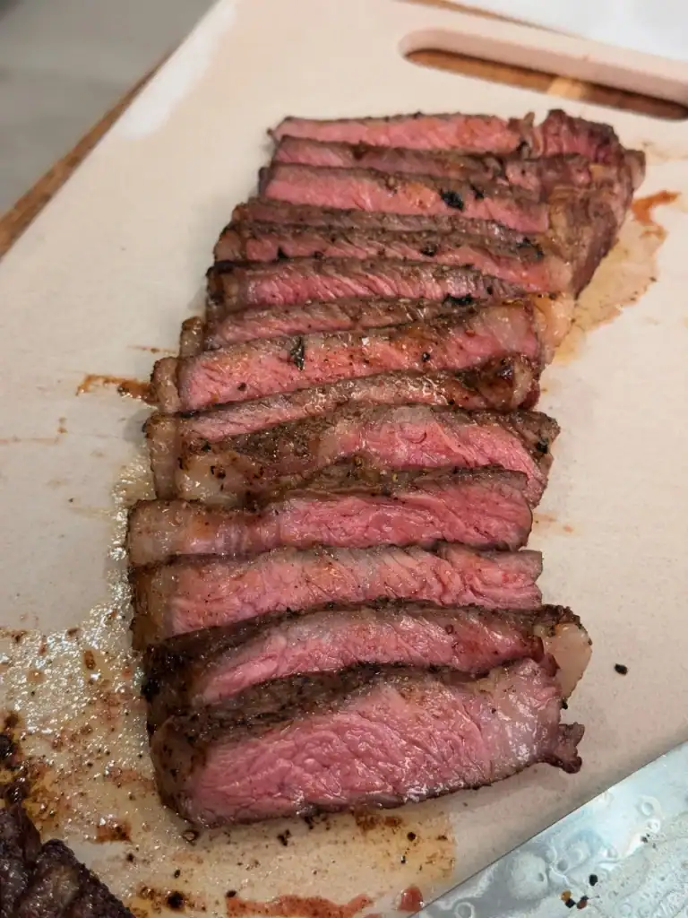 A row of freshly sliced reverse seared steak 