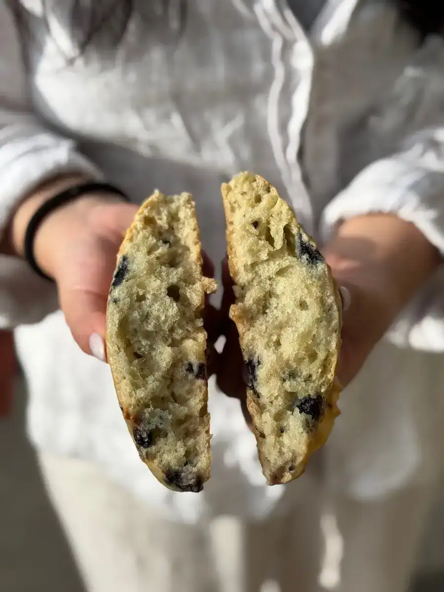 Blueberry and Cream Cheese Scone Split in Half, displaying chunks of blueberry and cream cheese from Diamond Head Market and Grill in Honolulu, Oahu, Hawaii